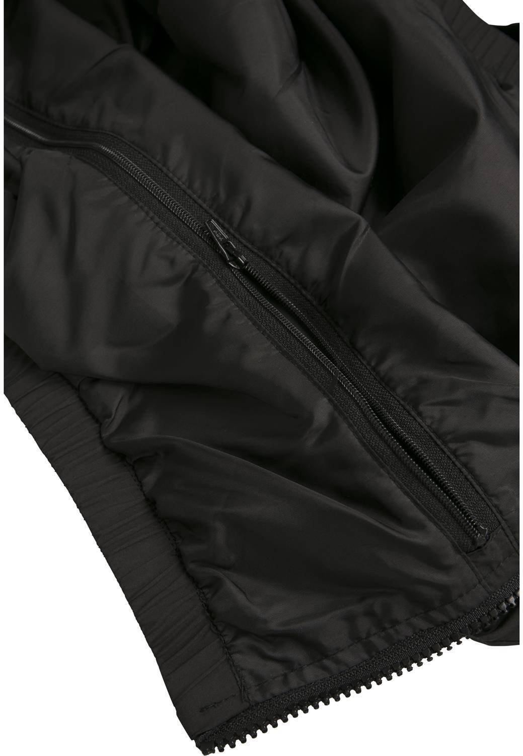 Kurtka damska zakładana przez głowę z dużą kieszenią na klatce piersiowej