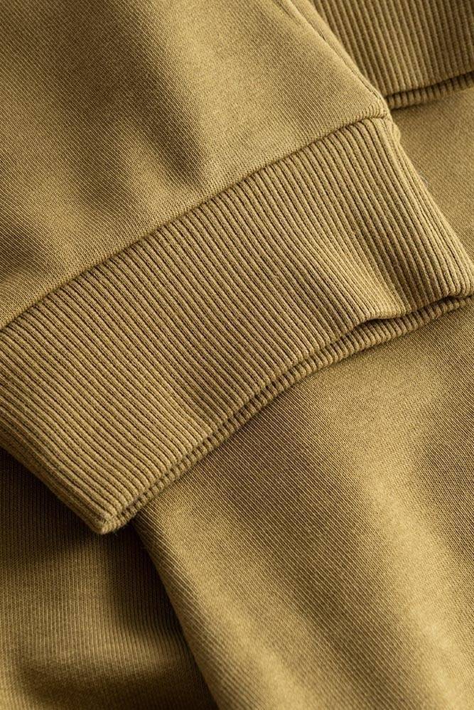 Spodnie dresowe męskie z zamykanymi kieszeniami w kolorze materiału